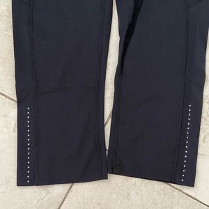 Black LuluLemon capris with dots on back legs. Good condition. Size 6. 2 pockets